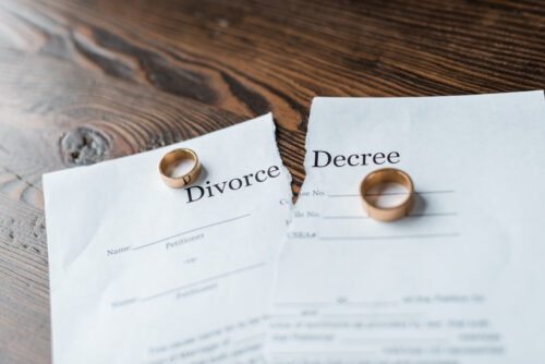 divorce decree with wedding rings